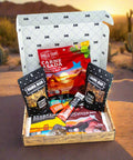 Adventure Tour Nut and Meat Gift Box with Damn, Man Snacks Thai Chili, Carne Asada, Coconut Chili Clusters, and more in desert setting