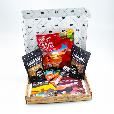 Adventure Tour Nut and Meat Gift Box with Thai Chili, Coconut Curry Cashews, Carne Asada Jerky, and other premium snacks from Damn, Man Snacks