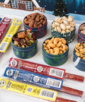 "Assortment of savory meat sticks and gourmet nuts in tins for the 12 Days of Winter Wonder gift set"