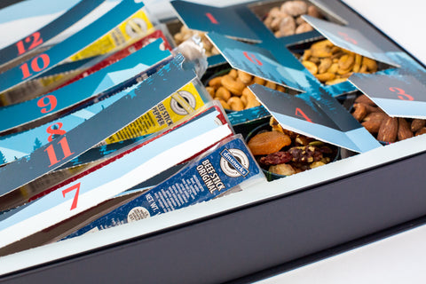 12 Days of Winter Wonder box with savory meat sticks and gourmet nuts for each day of the countdown.