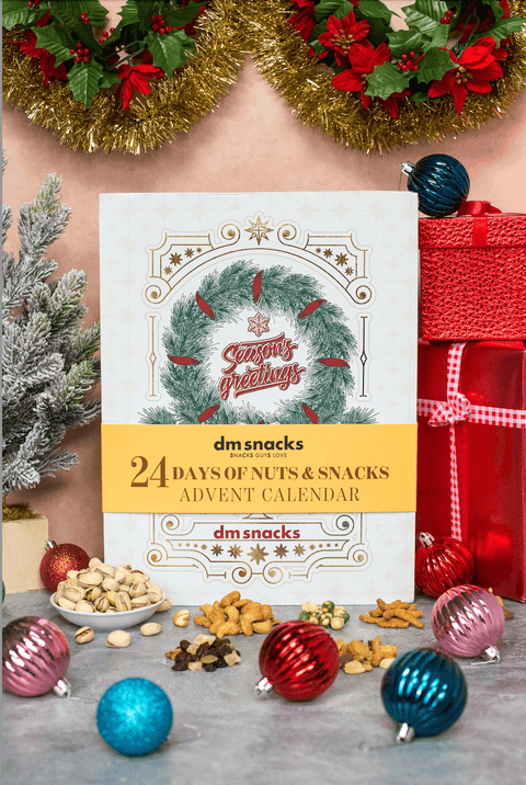 24 Days of Nuts & Snacks Holiday Advent Calendar with festive decorations and Christmas ornaments