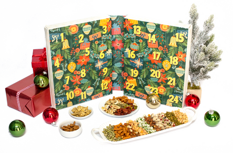 24 Days of Nuts & Snacks Holiday Advent Calendar with festive decorations and a variety of nuts and snacks displayed on a tray