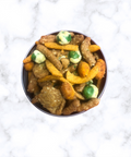 Taproom Nut Mix in a bowl on a marble surface - perfect snack with a sweet and spicy flavor for pairing with beer or drinks