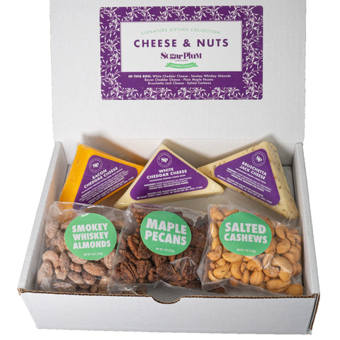 Signature Nuts and Cheese Box with flavored pecans, almonds, cashews, and gourmet cheeses arranged in an open gift box